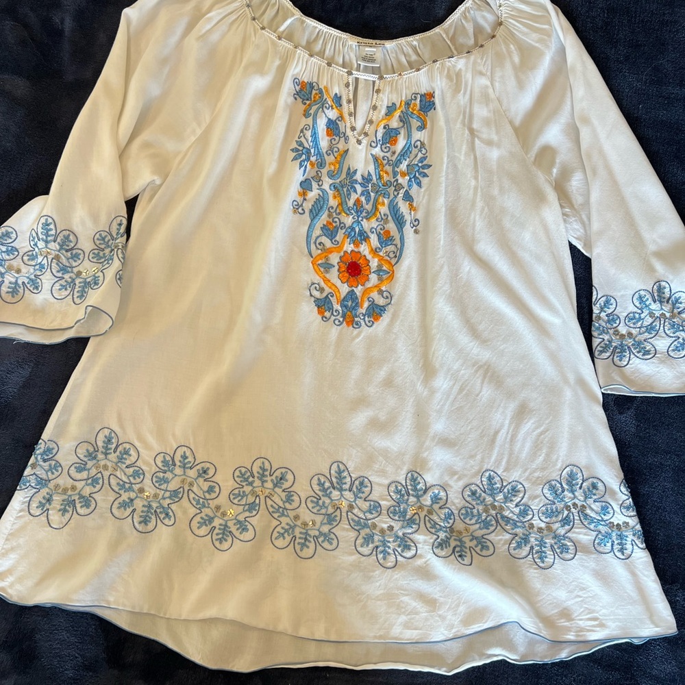 White with blue embroidered tunic